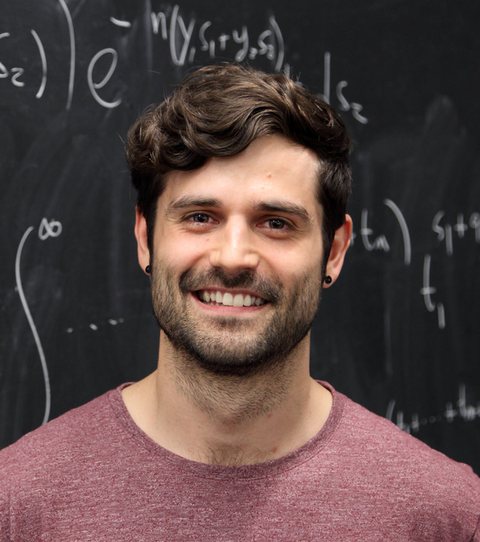 Jean Barbier in front of a blackboard